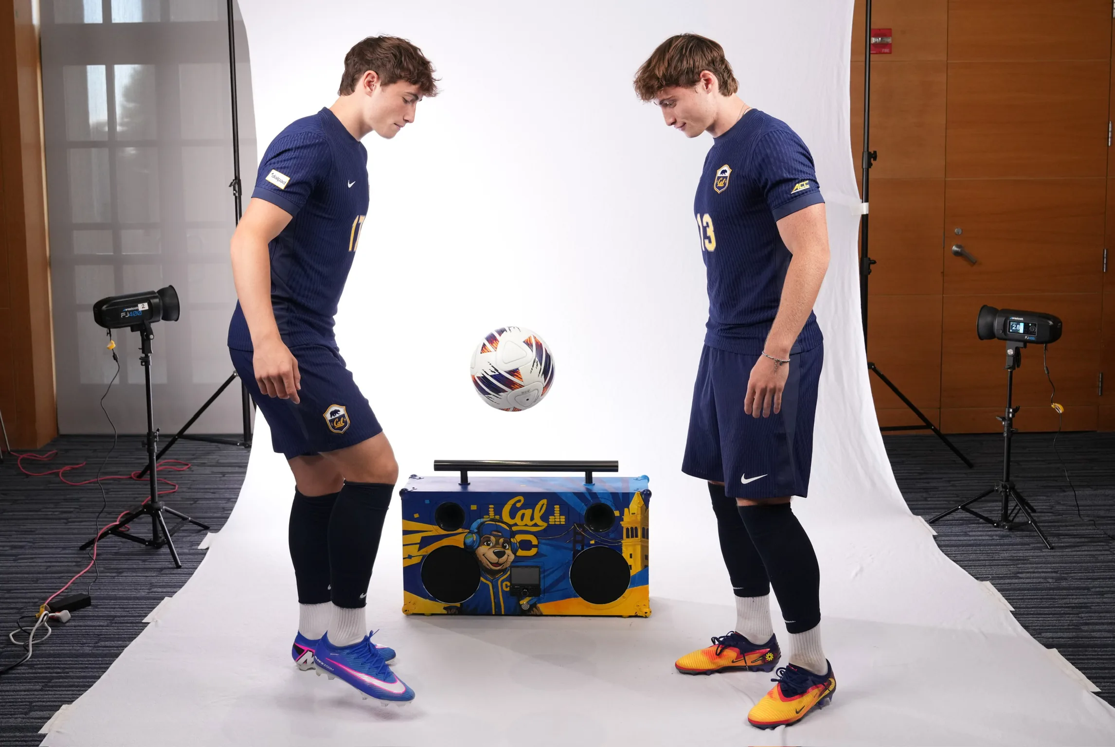 Kai and Miko Oppenheim juggling a ball between them in Cal kit, the two brothers who build every IDP plan